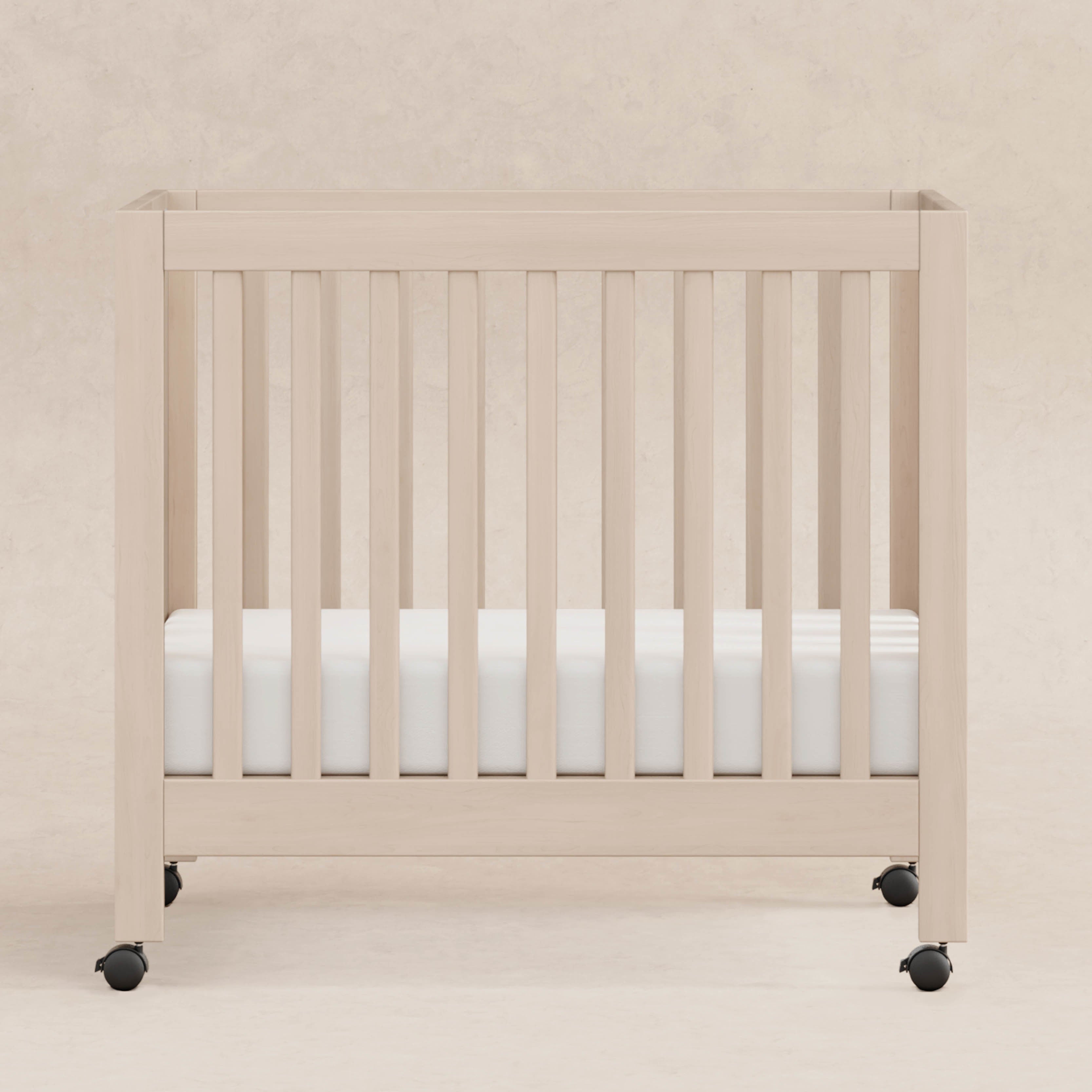 Origami Portable Mini Crib With Wheels | Babyletto